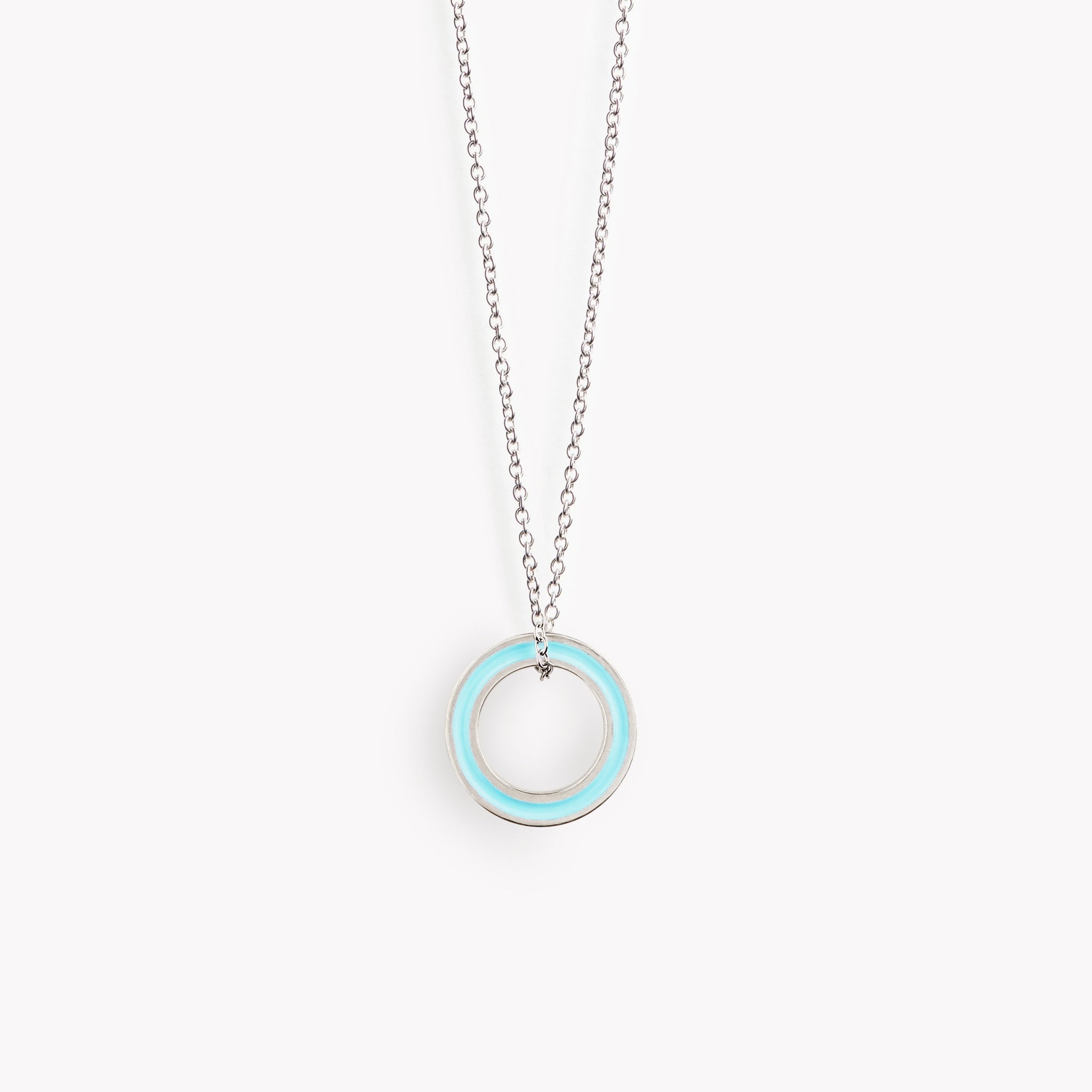 A simple turquoise circular necklace on a fine steel trace chain.