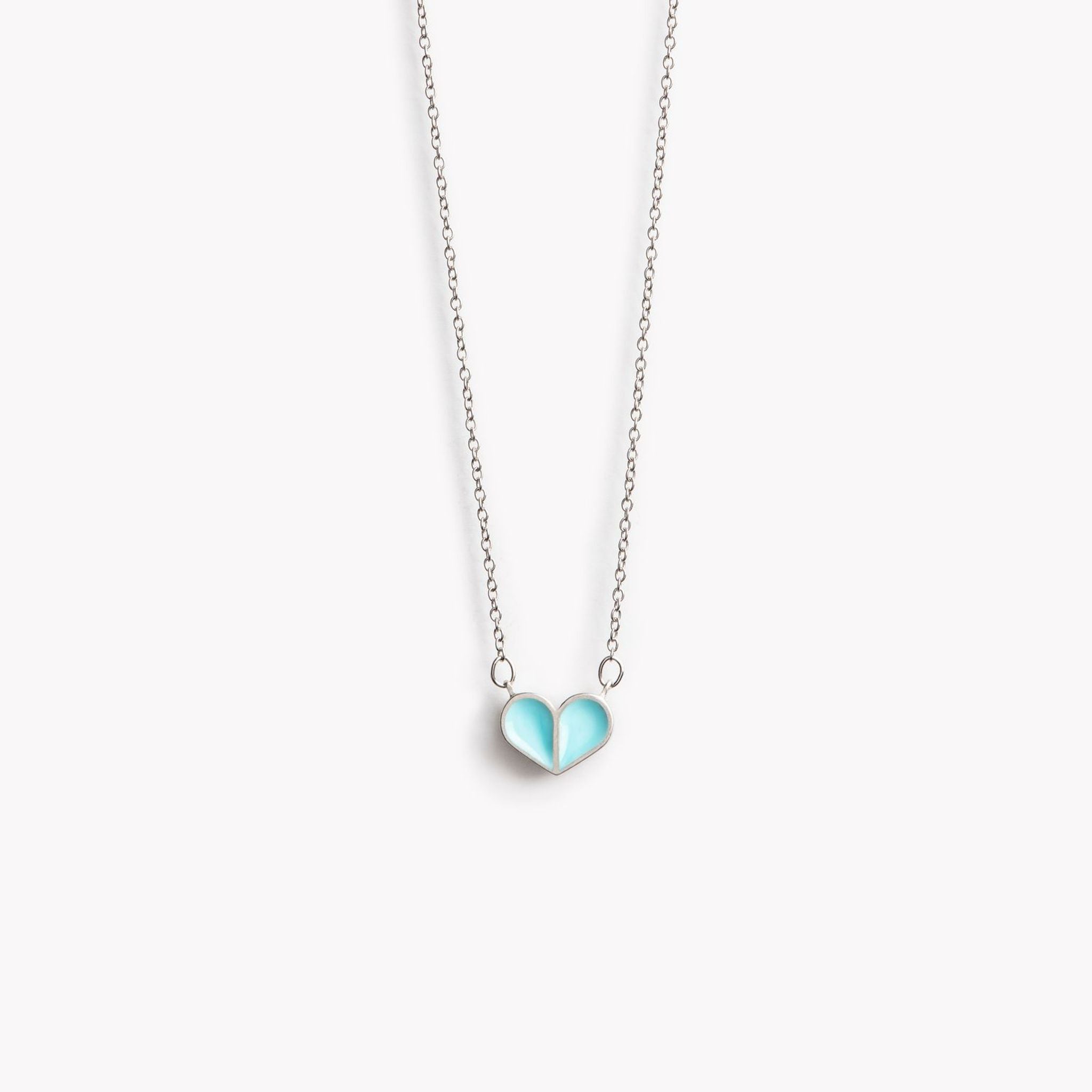 A simple pewter heart shaped pendant necklace in turquoise.