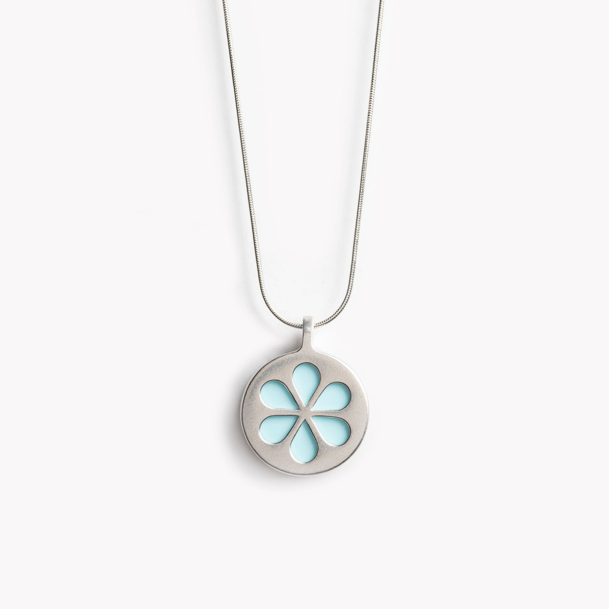 A simple circular pendant necklace with a pale turquoise flower petal design.